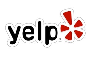 News 7 Yelp logo with black text and a red flower shape.