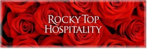 Logo with text "Rocky Top Hospitality" on a background of red roses.