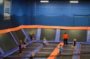 4th Friday Networking- Sky Zone 1 picture of children jumping on trampolines at a trampoline indoor park.
