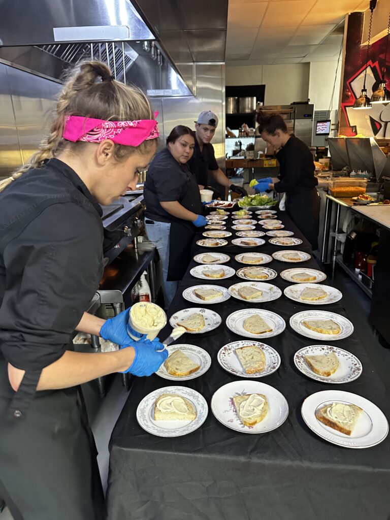 Lelia Kidd preparing a dish at Element Gastropub